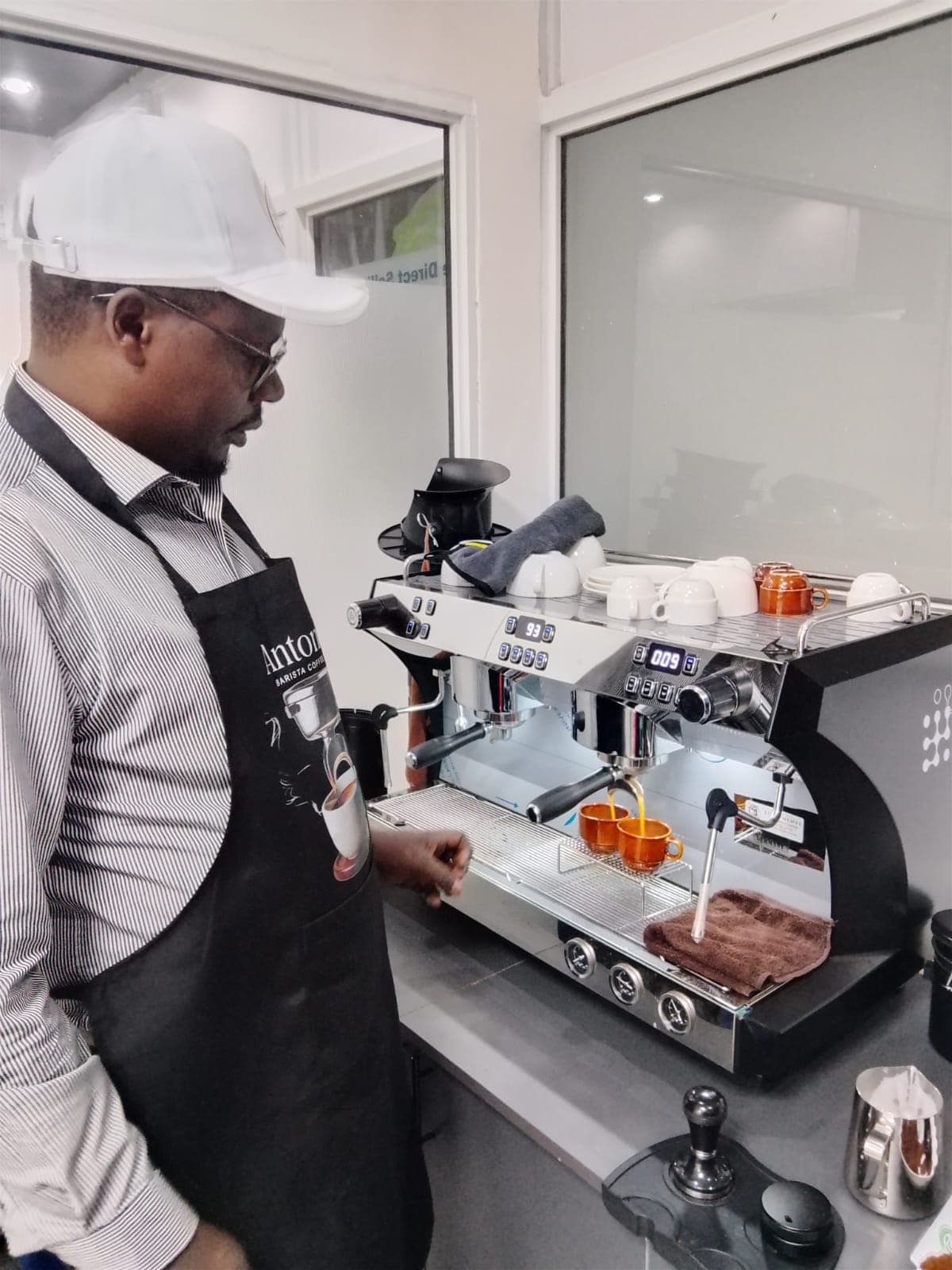 Antonov barista pulling an espresso shot on the lab's espresso machine