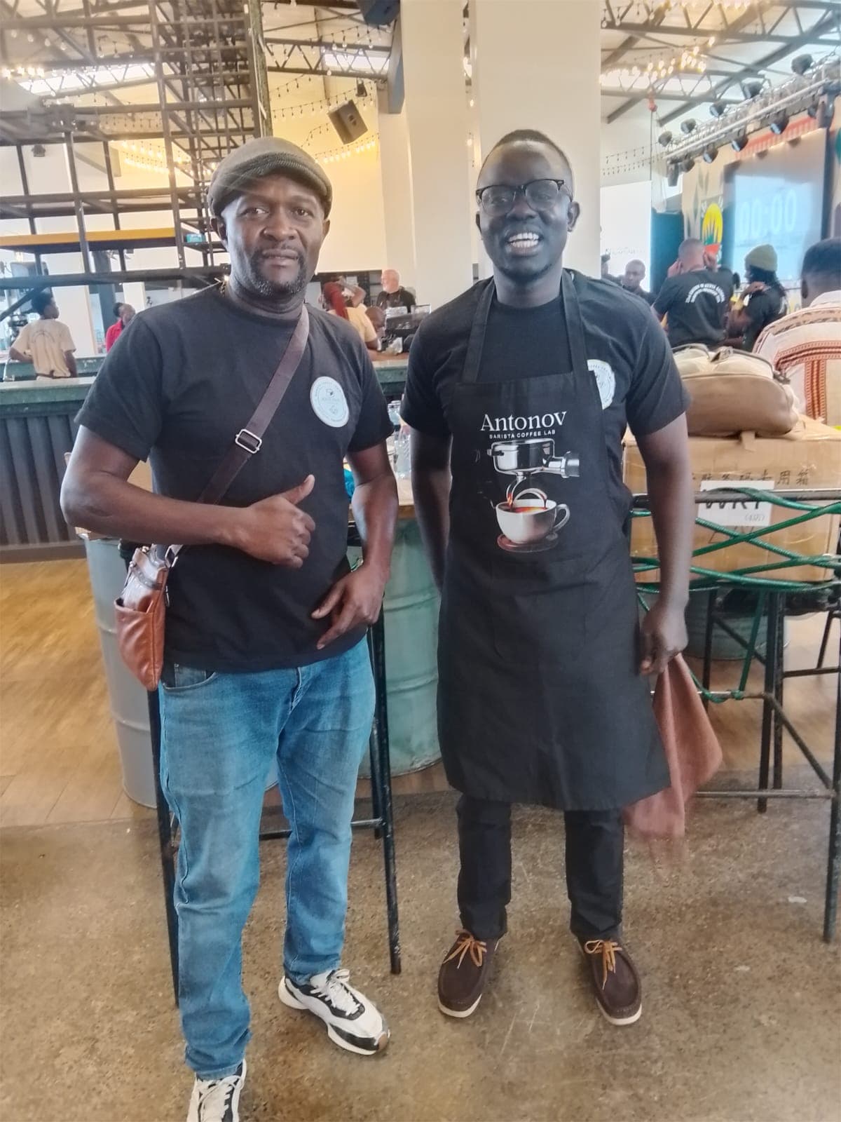 An Antonov student in an apron at a live coffee event