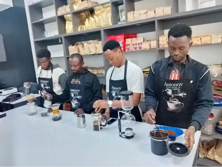 Students preparing coffee at the Antonov lab station during hands-on training